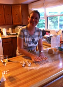 Rolling dough for gnocchi on kitchen counter