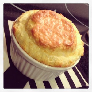 Close-up of individual-sized cheese souffle, cooling.